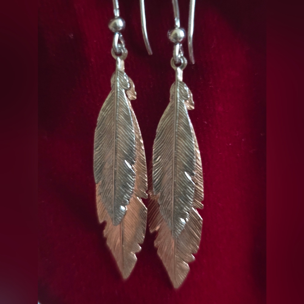SOLD slight rose gold coating light weight feather earrings, with French back.